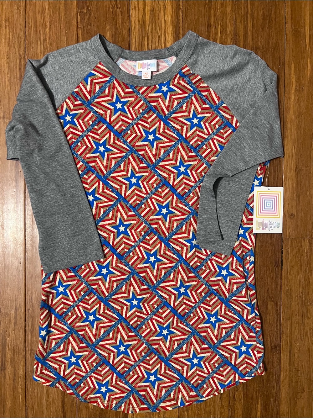 LuLaRoe Randy Raglan Top in Gray with Red, White & Blue Star Pattern